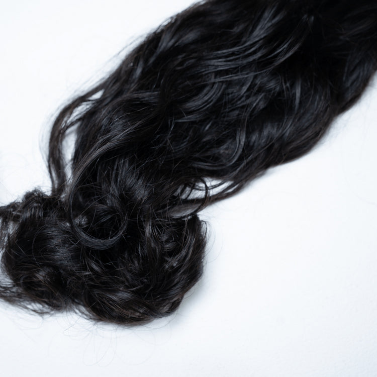 100% Virgin Human Hair Natural Wave Bundles styled in loose waves