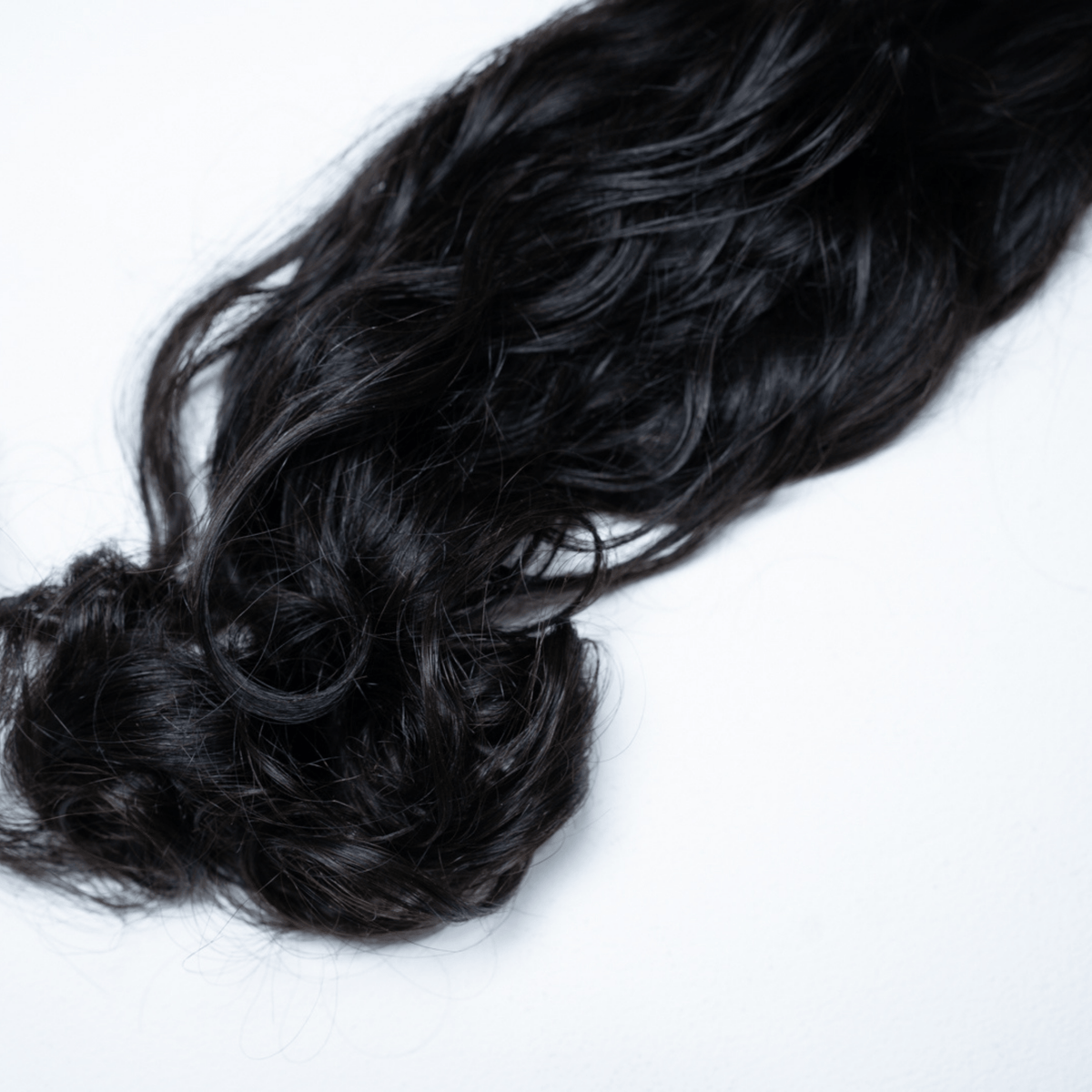 100% Virgin Human Hair Natural Wave Bundles styled in loose waves